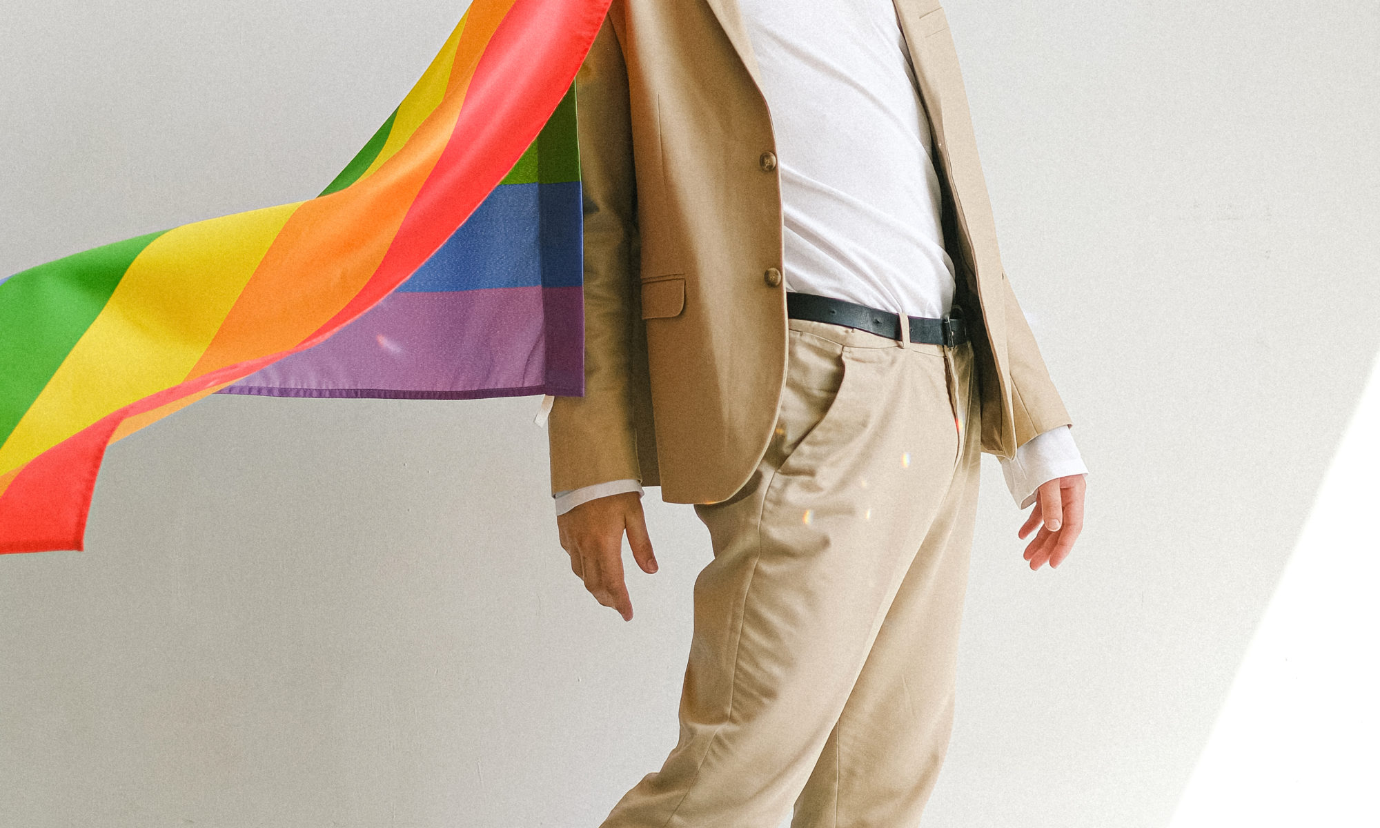 Man with a gay pride flag