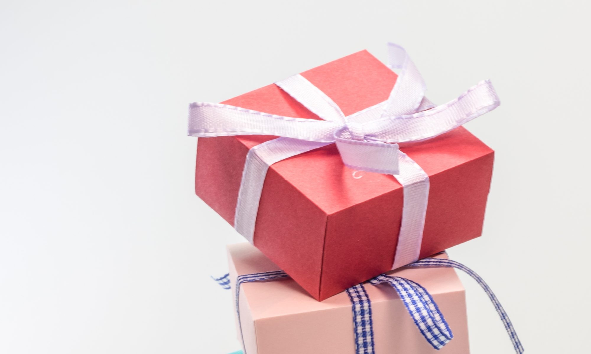 Three stacked gift boxes with different colors