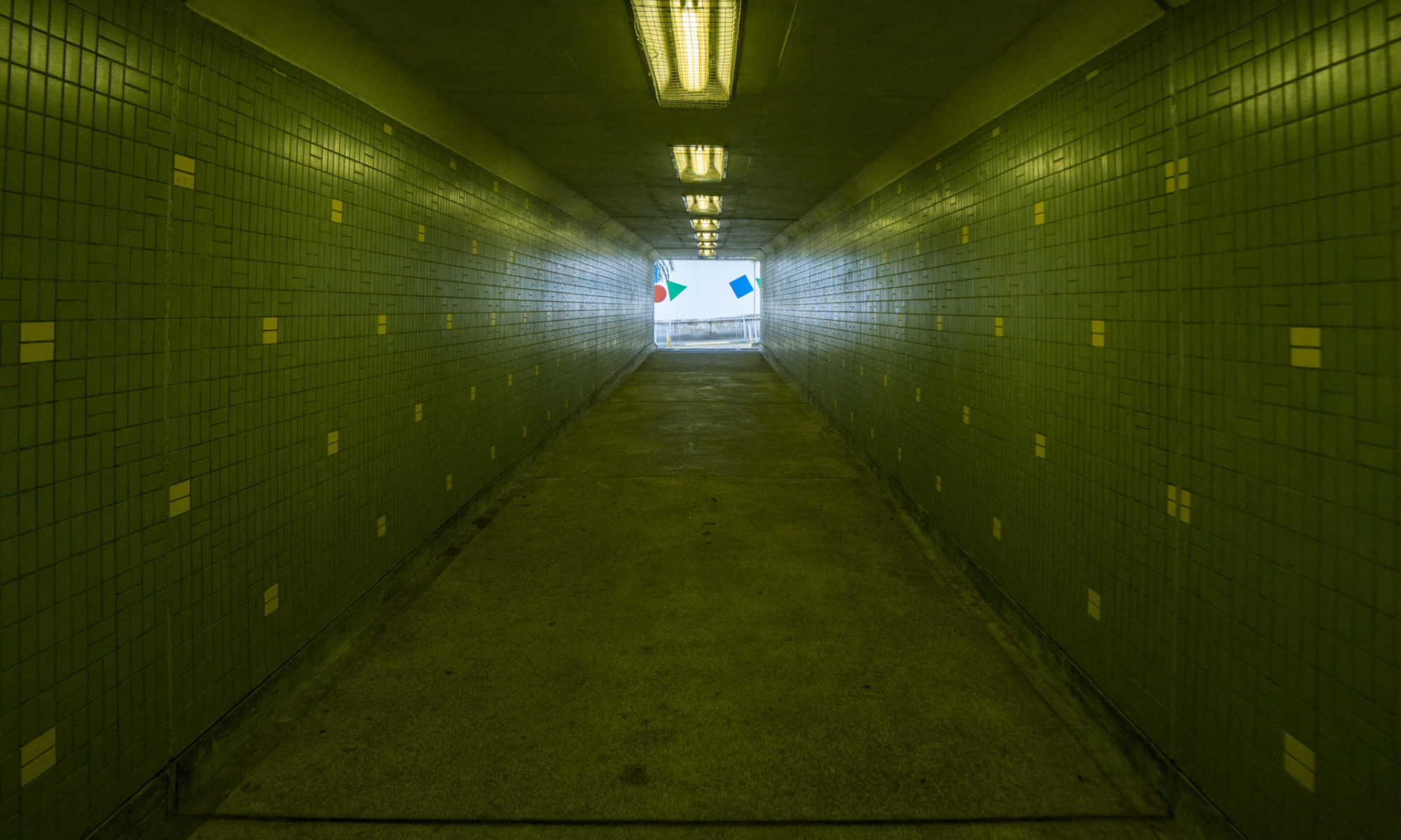 Green tiled hallway